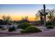 Tranquil landscaping featuring native plants, artistic sculptures and sunset views at 9716 E Mariposa Grande Dr, Scottsdale, AZ 85255