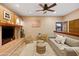 Inviting living room with plush seating, ceiling fan, and unique decorative touches at 9716 E Mariposa Grande Dr, Scottsdale, AZ 85255