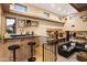 Entertain in style with a full wet bar, comfortable seating, and easy access to adjacent living spaces at 9716 E Mariposa Grande Dr, Scottsdale, AZ 85255