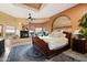 Elegant main bedroom featuring a fireplace, bay window, and beautiful views of the surrounding landscape at 9716 E Mariposa Grande Dr, Scottsdale, AZ 85255