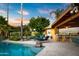This outdoor paradise includes a pool, built in barbeque, lounge seating and mature landscaping at 9716 E Mariposa Grande Dr, Scottsdale, AZ 85255