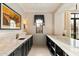 Well-lit bar area with marble countertops, custom cabinetry, and designer fixtures at 10244 E Hualapai Dr, Scottsdale, AZ 85255