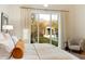 Bright bedroom featuring a view of the pool and backyard at 10244 E Hualapai Dr, Scottsdale, AZ 85255