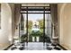 Foyer with black and white checkered floors and view of pool at 10244 E Hualapai Dr, Scottsdale, AZ 85255