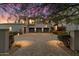 Exterior view of the three-car garage and driveway at 10244 E Hualapai Dr, Scottsdale, AZ 85255