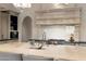 Gourmet kitchen featuring a large island with seating, high-end appliances, and custom cabinetry at 10244 E Hualapai Dr, Scottsdale, AZ 85255