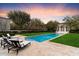 Inviting pool with travertine deck and chaise lounges, perfect for relaxation and enjoying the outdoors at 10244 E Hualapai Dr, Scottsdale, AZ 85255