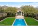 Aerial view of swimming pool with cabana and mountain backdrop at 10244 E Hualapai Dr, Scottsdale, AZ 85255