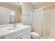 Bathroom featuring shower stall, toilet and vanity with mirror and lighting at 10816 W Hatcher Rd, Sun City, AZ 85351