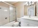 Bathroom featuring shower stall, toilet and vanity with mirror and lighting at 10816 W Hatcher Rd, Sun City, AZ 85351