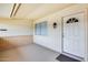 Covered entrance with a decorative front door, a sidelight window, and neutral tones at 10816 W Hatcher Rd, Sun City, AZ 85351