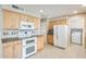 Well-equipped kitchen with stainless steel appliances and ample cabinet space at 10816 W Hatcher Rd, Sun City, AZ 85351