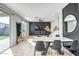 Open dining area featuring modern table set, contemporary lighting and floor-to-ceiling mirror at 10823 W Polk St, Avondale, AZ 85323