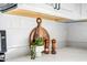 Close-up of white countertops, a wooden cutting board, and decorative elements, adding a touch of charm at 10823 W Polk St, Avondale, AZ 85323