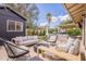 A backyard featuring an outdoor seating area with a fire pit and a view of the built in grill at 10903 E Sahuaro Dr, Scottsdale, AZ 85259