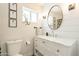 Modern bathroom featuring a white vanity with marble countertop, shiplap walls, and stylish fixtures at 10903 E Sahuaro Dr, Scottsdale, AZ 85259