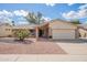 Charming single-story home featuring a two-car garage, manicured front yard, and appealing curb appeal at 10903 E Sahuaro Dr, Scottsdale, AZ 85259