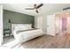 Well-lit main bedroom showcases an elegant accent wall, modern fixtures, and a spacious open floorplan at 10903 E Sahuaro Dr, Scottsdale, AZ 85259