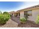 Pleasant backyard with a covered patio surrounded by lush greenery at 11046 E Naranja Ave, Mesa, AZ 85209