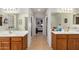 Bathroom featuring double sinks, tile floors, and separate vanity areas at 11046 E Naranja Ave, Mesa, AZ 85209