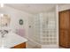 Bright bathroom with a glass block shower, and wood cabinets, offering a clean and functional space at 11046 E Naranja Ave, Mesa, AZ 85209