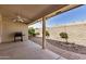 Cozy covered patio with brick accents, a ceiling fan, and an outdoor grill at 11046 E Naranja Ave, Mesa, AZ 85209