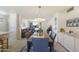 A dining room featuring a modern table and chairs, stylish light fixture, and an open layout at 1139 S 79Th St, Mesa, AZ 85208