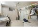 Spacious garage featuring storage cabinets, a work area, and ceiling fan at 1139 S 79Th St, Mesa, AZ 85208