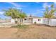 This backyard features a covered patio area and mature shade trees at 11430 N 57Th Dr, Glendale, AZ 85304