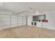 Spacious two car garage with built-in storage cabinets and work area at 11430 N 57Th Dr, Glendale, AZ 85304