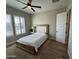 Bedroom features wood-look flooring and plantation shutters on the windows at 11612 W Candelilla Way, Peoria, AZ 85383