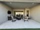 Inviting covered patio with outdoor furniture, a television, and a view of the backyard at 11612 W Candelilla Way, Peoria, AZ 85383