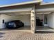 Spacious three-car garage with epoxy flooring and storage racks at 11612 W Candelilla Way, Peoria, AZ 85383