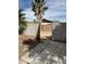 Gated access to the backyard shows low-maintenance landscaping and block fence for privacy at 1172 E Delano Dr, Casa Grande, AZ 85122