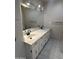 Bathroom with dual sinks, marble counters and white cabinets at 1172 E Delano Dr, Casa Grande, AZ 85122