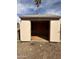 Exterior view of the storage shed with open doors to reveal the interior shelving at 1172 E Delano Dr, Casa Grande, AZ 85122