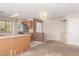 Kitchen with stainless appliances, wood cabinets, tile floors, and breakfast bar at 14787 W Aster Dr, Surprise, AZ 85379