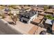 An aerial view of a home with a dark roof and a long driveway in a suburban neighborhood at 15619 N 30Th Ave, Phoenix, AZ 85053