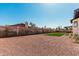 Gravel backyard with block wall and small patch of well-maintained artificial turf at 15619 N 30Th Ave, Phoenix, AZ 85053