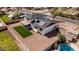 Aerial view of a backyard with a small patch of green grass and a xeriscaped perimeter at 15619 N 30Th Ave, Phoenix, AZ 85053