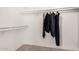 Walk-in closet featuring an ample clothing rack and built-in shelving for optimal storage at 15619 N 30Th Ave, Phoenix, AZ 85053