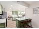 Spacious kitchen and dining space featuring stainless steel appliances, quartz countertops, and a bright atmosphere at 15619 N 30Th Ave, Phoenix, AZ 85053