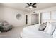 Well-lit bedroom featuring neutral tones, modern furnishings, and cozy seating offers a tranquil and inviting space at 15619 N 30Th Ave, Phoenix, AZ 85053