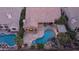 Backyard featuring a sparkling pool, stone patio, mature landscaping and a private outdoor living space at 16060 S 4Th St, Phoenix, AZ 85048