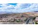 Scenic aerial view of a residential neighborhood with mountain views under a partly cloudy sky at 16060 S 4Th St, Phoenix, AZ 85048