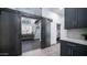 A dining area with sliding barn doors overlooks a bedroom and bathroom at 16060 S 4Th St, Phoenix, AZ 85048