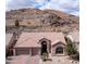 Attractive home with a well-manicured front yard, a charming facade, and a peaceful desert backdrop at 16060 S 4Th St, Phoenix, AZ 85048