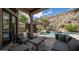 Backyard oasis with a lush pool and outdoor living area ideal for relaxation and entertainment at 16060 S 4Th St, Phoenix, AZ 85048