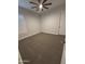 Neutral bedroom with carpet, ceiling fan, and window shutters at 17019 W Cameron Dr, Surprise, AZ 85388