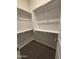 Walk-in closet with ample shelving and storage space at 17019 W Cameron Dr, Surprise, AZ 85388